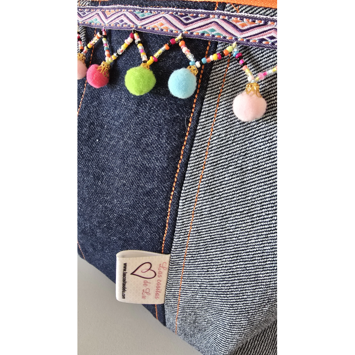 Clutch Denim con pompones